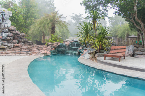 Beautiful Luxury Home And Chair Around Outdoor Swimming Pool