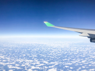 Obraz premium Airplane flying above many clouds