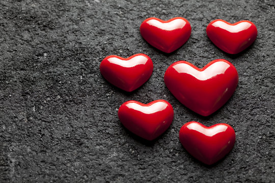 Red hearts on black  background