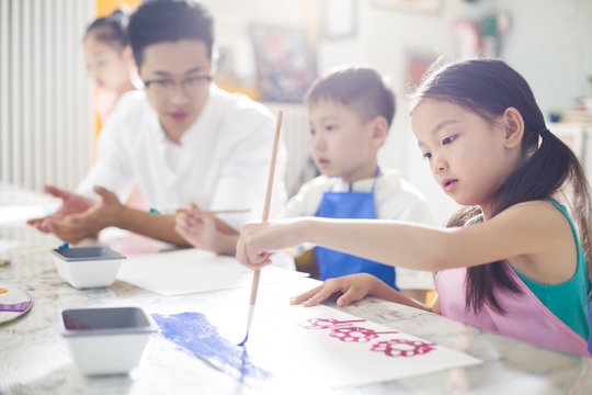 Children painting in art class