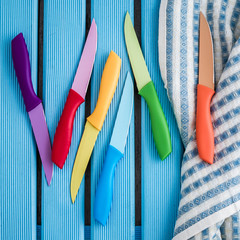 Set of Colorful Kitchen Knives on a Napkin