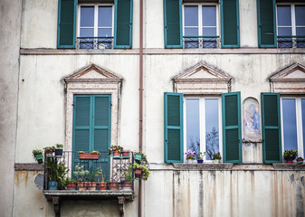 Fototapeta na wymiar facade of a typical Italian building. Traditional European archi
