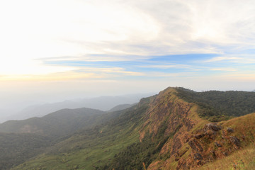 Landscape with the green grass on mountain in sunrise, Doimonjong Thailand