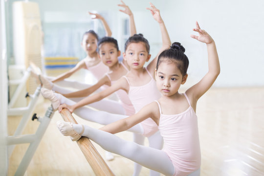 Children practicing ballet dance in studio
