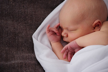 cute newborn baby in the blanket