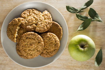 Oatmeal cookies with apple and bay leaf top view