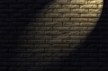 Brick wall textured/Wall made of decorative yellow brick as a background. The backlight lamp in the evening.