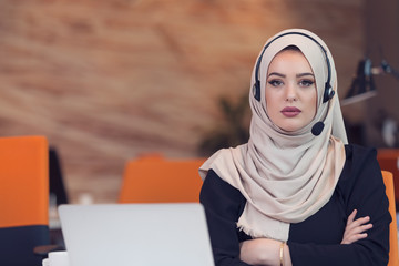Beautiful phone operator arab woman working in startup office