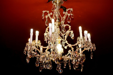 Golden beautiful chandelier on a black background