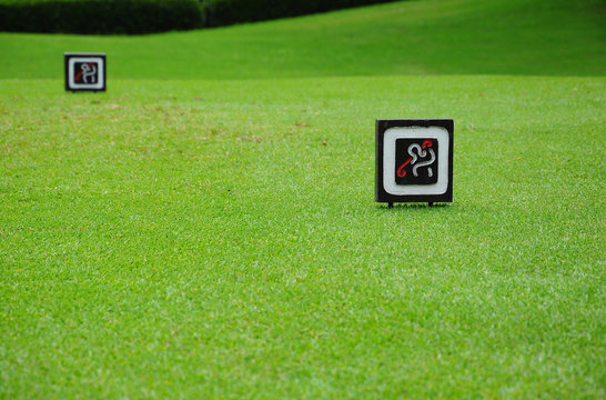 Signs at tee off on golf course