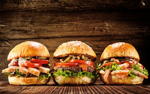 Three delicious chicken, beef and seafood burgers