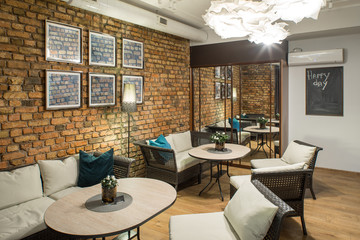 Interior of restaurant.  Brick wall. Modern design.