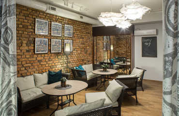 Interior of restaurant.  Brick wall. Modern design.