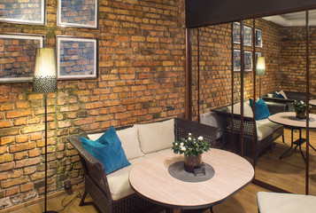 Interior of restaurant.  Brick wall. Modern design.