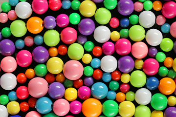 plastic round colored beads. background  1