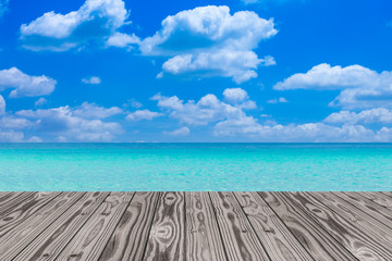 Wood grain deck floor over beautiful sea and sky background