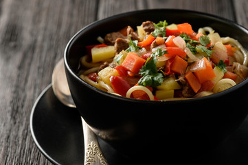 Asian traditional soup with noodles, meat and vegetables known as lagman.