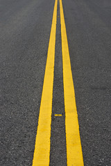 yellow traffic lines on the road.