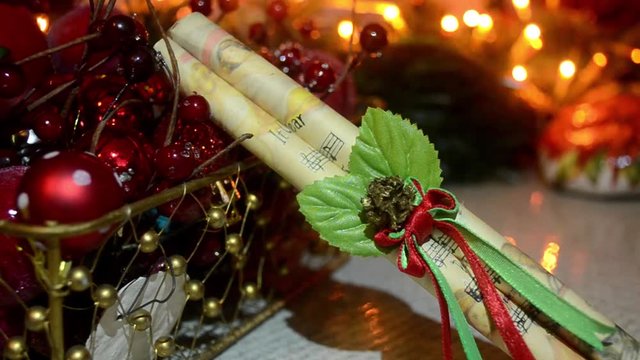 close up of decorative Christmas ornaments with blinking lights background