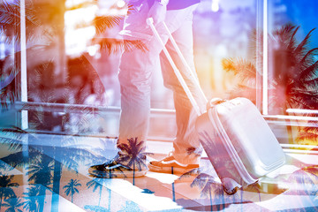 Double exposure man pulling suitcase in the airport to travel wi