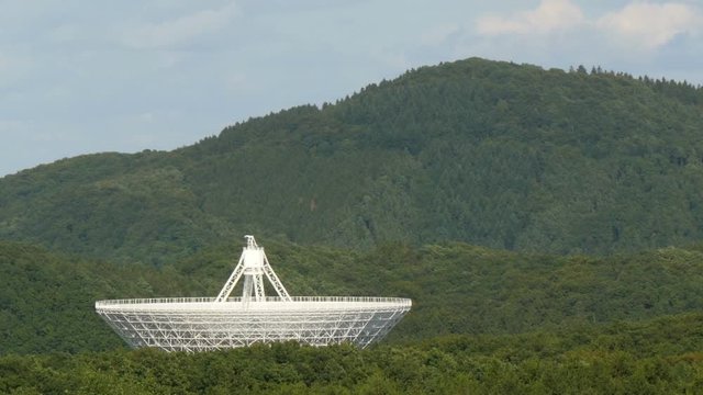 The giant Effelsberg 100-m Radio Telescopein a valley - time lapse. 11819
