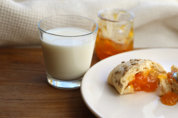 bun with homemade jam and milk, food rural, rustic breakfast, homemade food.