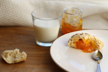 bun with homemade jam and milk, food rural, rustic breakfast, homemade food.