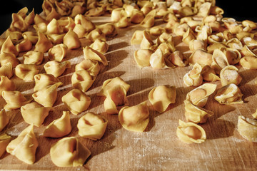 tortellini homemade laid on cutting board