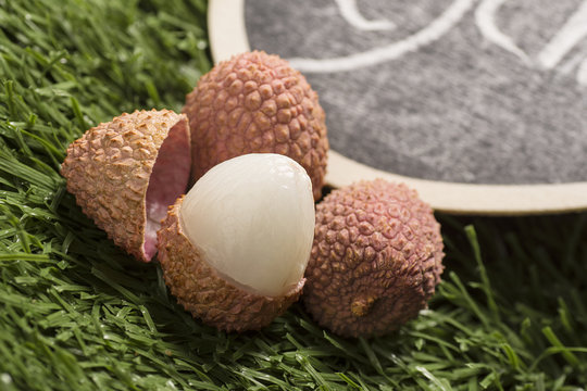 Lychees on grass background