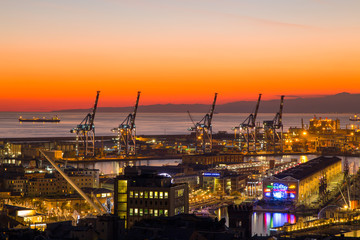 GENOA (GENOVA) , ITALY, DECEMBER 28, 2016: Sunset view of the city of Genoa, Italy, The harbor with Lanterna (lighthouse) the symbol of the city.