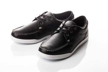 black men's shoes on a white background
