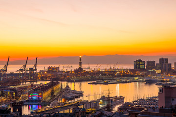 GENOA (GENOVA) , ITALY, DECEMBER 28, 2016: Sunset view of the city of Genoa, Italy, The harbor with Lanterna (lighthouse) the symbol of the city.