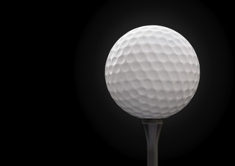 Golf ball on tee on black background.