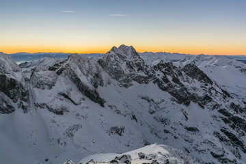 Winter landscape of mountains at sunset.