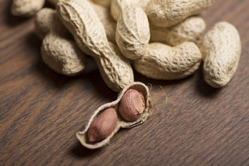 Peanuts on wooden background