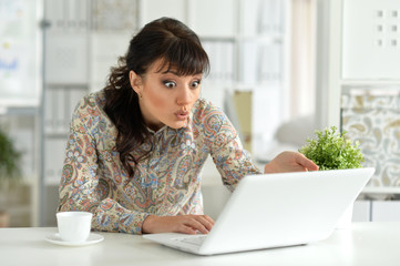 Fototapeta premium Exited woman with laptop