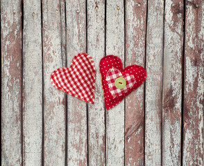 two textile hearts. Textile handicraft isolated on wooden background. Valentines Day, Wedding composition with hearts.