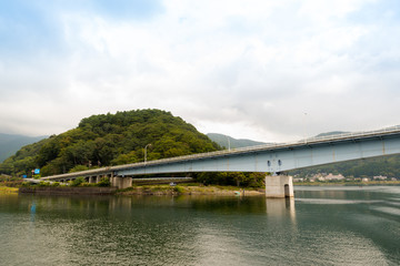 Fototapeta na wymiar Kawaguchiko lake and the bridge in autumn, Yamanashi, Japan