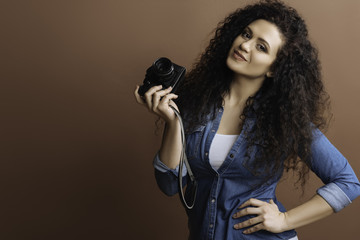 Positive delighted model posing with hand on the belt
