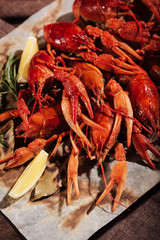 Close up of crayfishes with lemon standing on a table