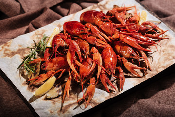 Crayfishes with lemon lying on pita in restaurant