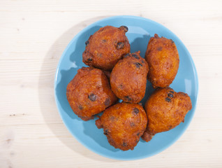 Traditional Dutch oliebollen on wooden background