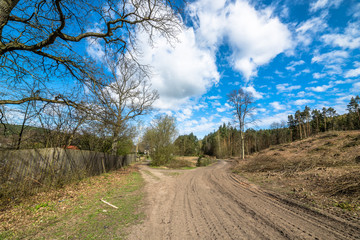 Crossroads in countryside landscape in spring