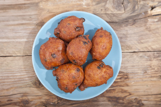 Traditional Dutch oliebollen on wooden background