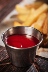 Close up of sauce being served with French fries