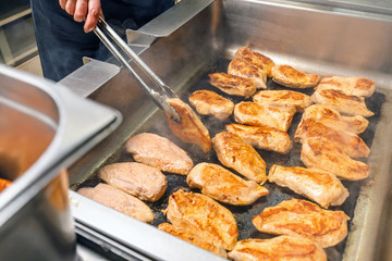 Chicken breasts on a grill