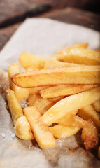 French fries and sauce standing on a table