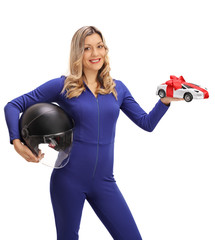 Happy female car racer holding helmet and model car © Ljupco Smokovski