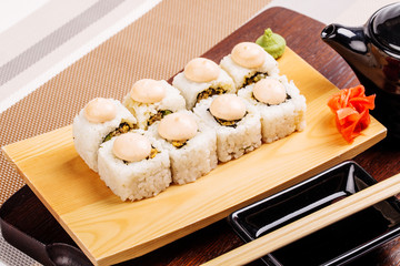 Sushi Roll on wood plate. Japanese cuisine
