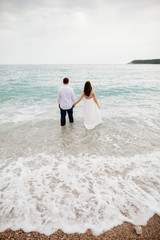 couple relax on beach together